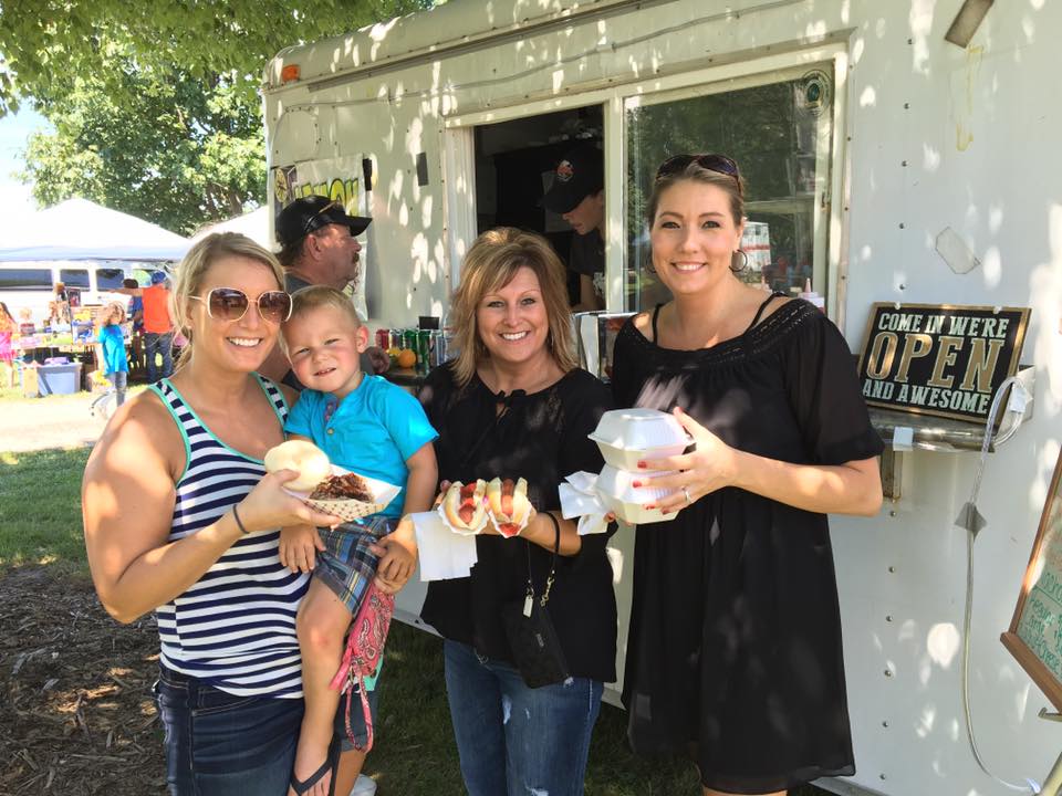 a family shows off their food at Ashmore Ag Days in 2016