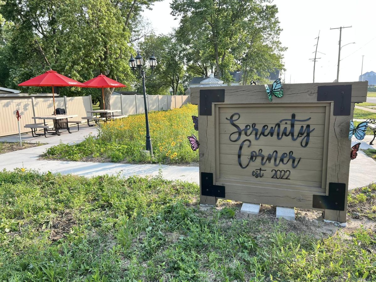Serenity Corner sign with wildflowers