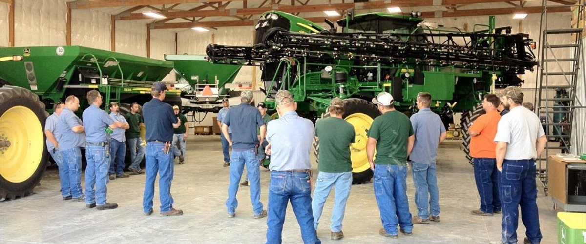 photo of AHW employees looking at equipment